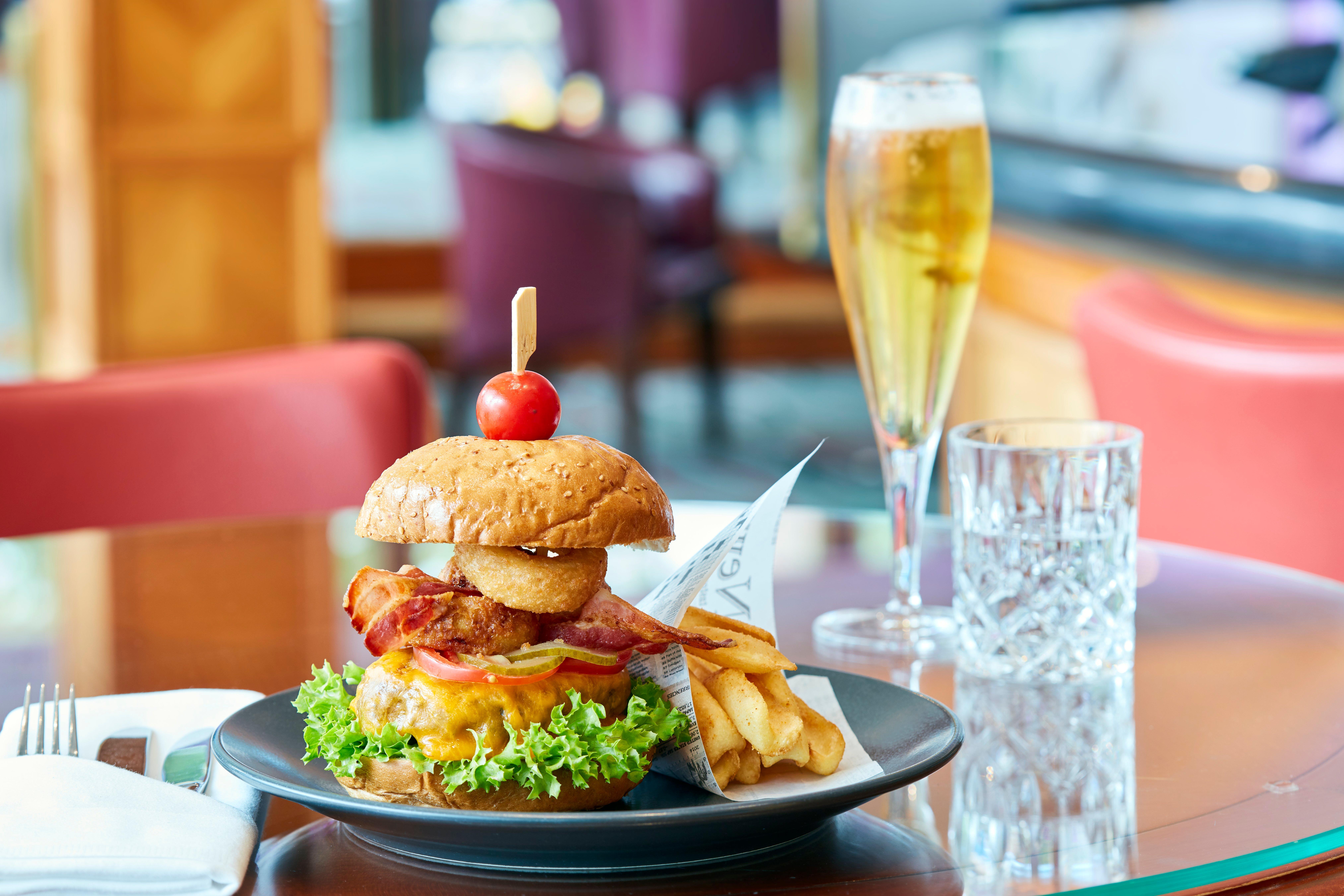 Intercontinental Berlin By Ihg Hotel Exterior photo A hamburger with chips and a glass of champagne